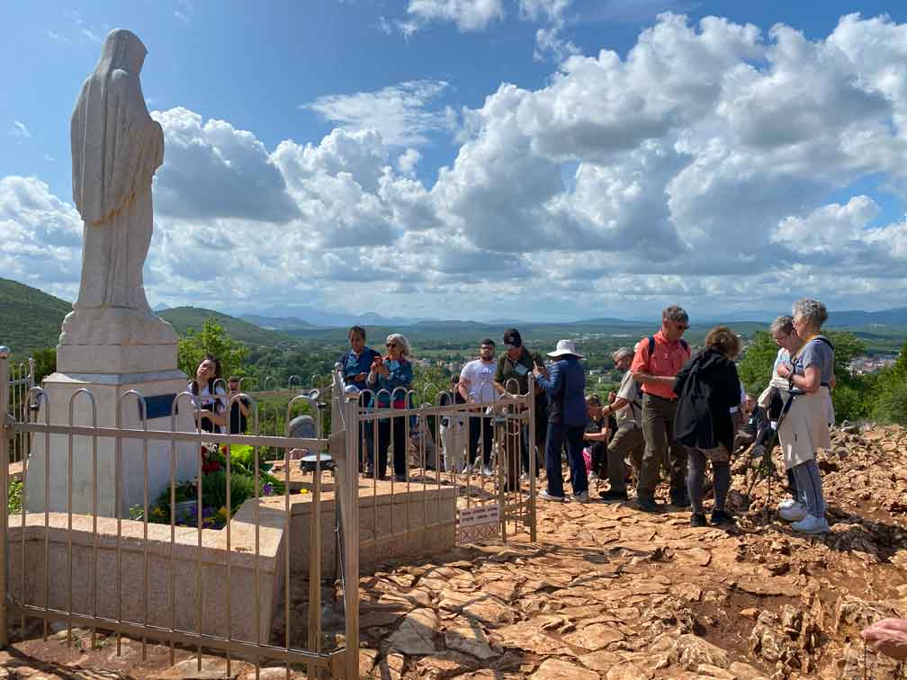 Catholic Group Pilgrimage at top of Apparition Hill Medjugorje