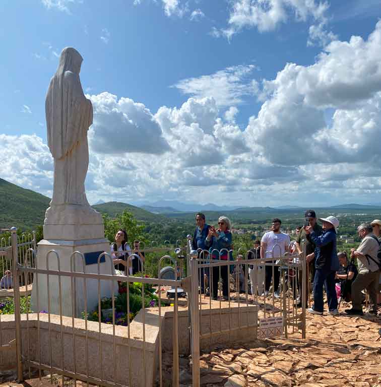 Catholic Group Pilgrimage at top of Apparition Hill Medjugorje